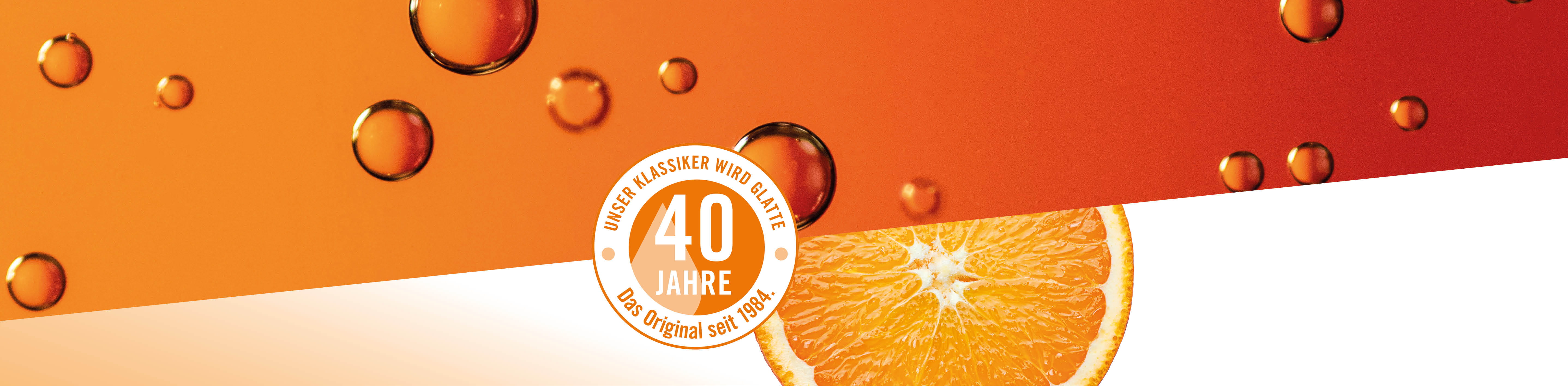 Header Fett-Feucht Balancer Pflegeserie 40 Jahre 40 Jahre Signet und Orangenscheibe und orange Bläschen